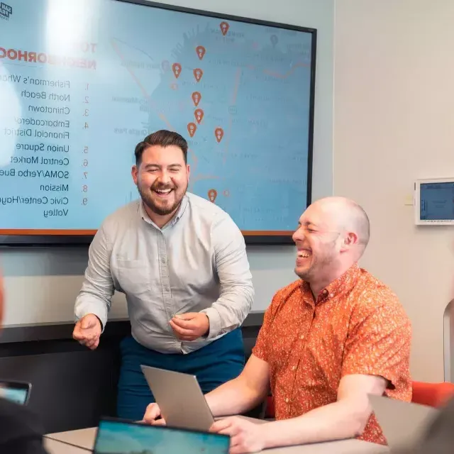 Man facilitating a meeting. He made someone laugh.